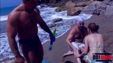 Cute girl gets fucked on the beach in a great threesome